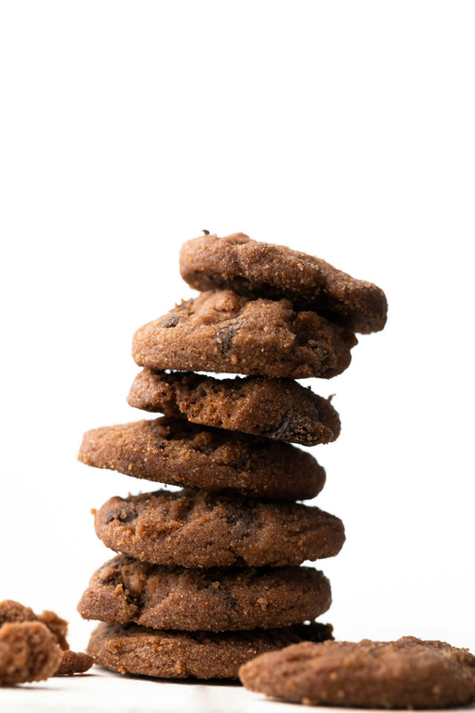 Stack of chewy gingersnap cookies with sugar-crusted crackly tops
