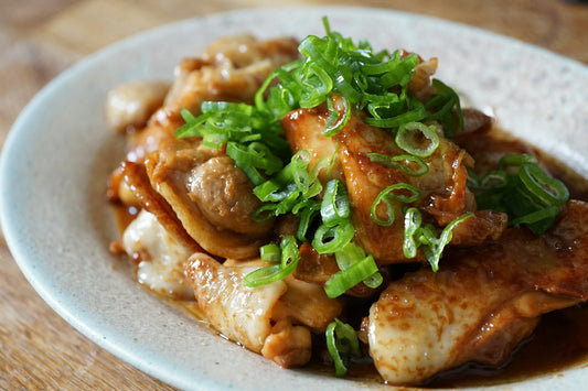 Hawaiian Huli Huli Chicken with Jaca - sticky pineapple-soy glazed chicken thighs garnished with green onions