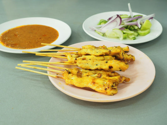 Chicken satay skewers with Jaca peanut sauce and cucumber salad